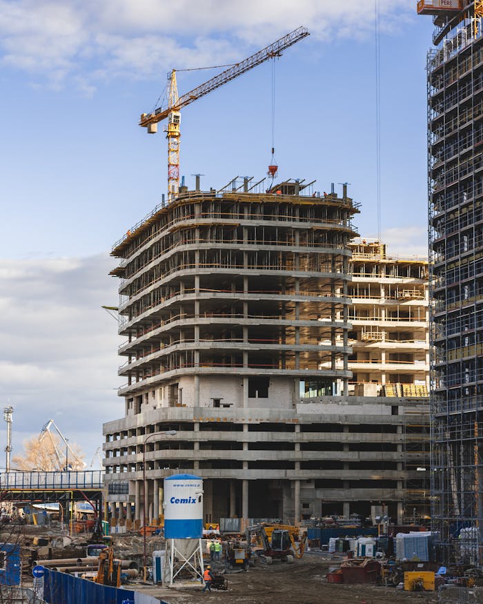 Construction site of a modern high-rise building with cranes in Bratislava, Slovakia.